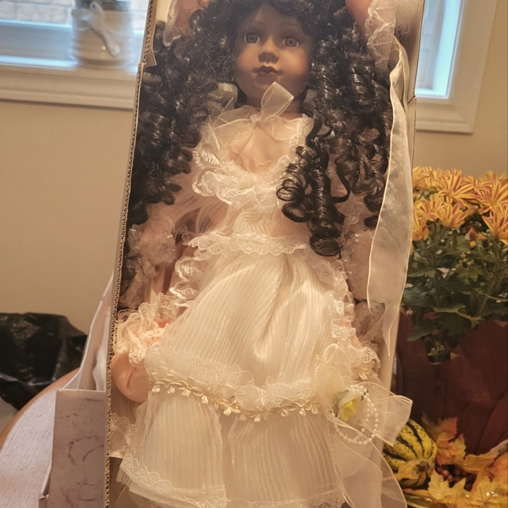 Porcelain Doll! Stands 25 inches! Cream dress With Brown Curls in her